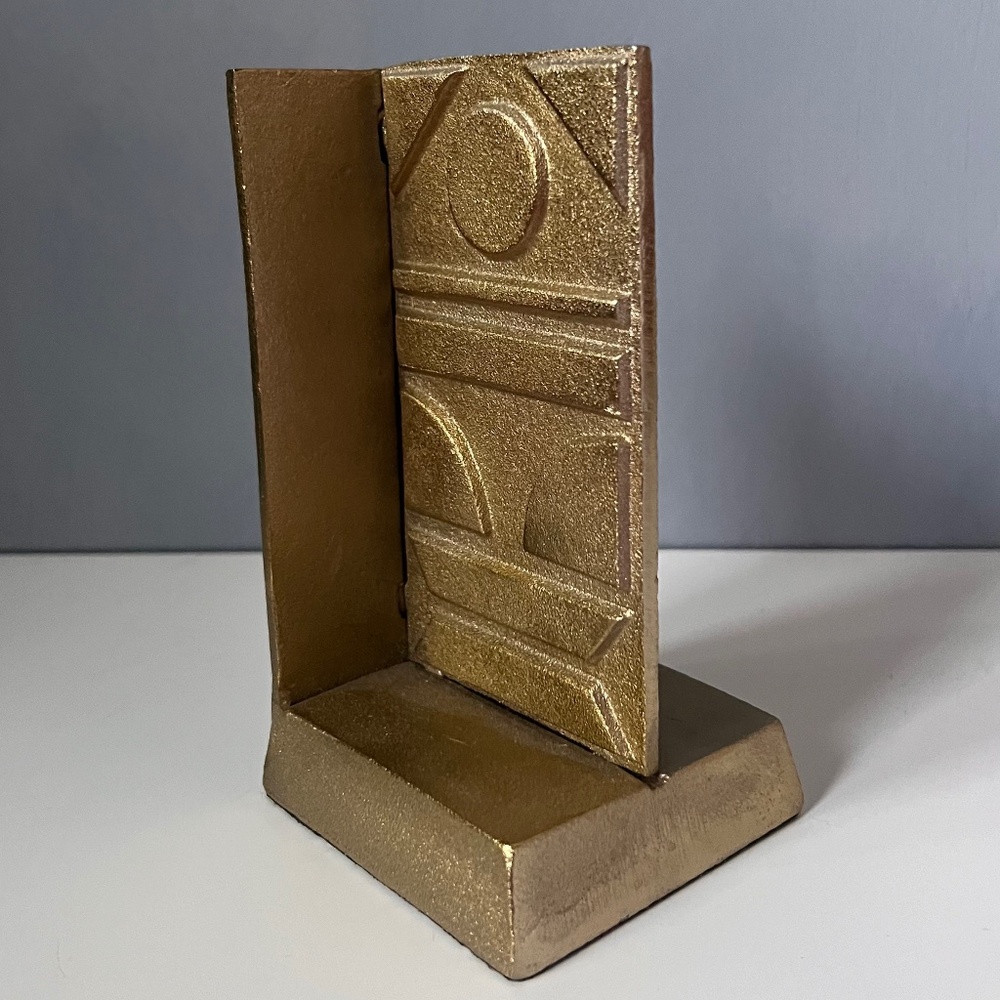 West Elm sculptural bookend in textured antique gold finish.